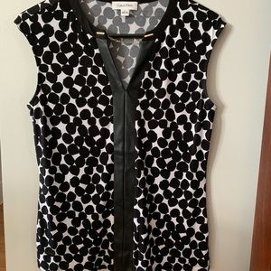 Calvin Klein black and white sleeveless shirt.
